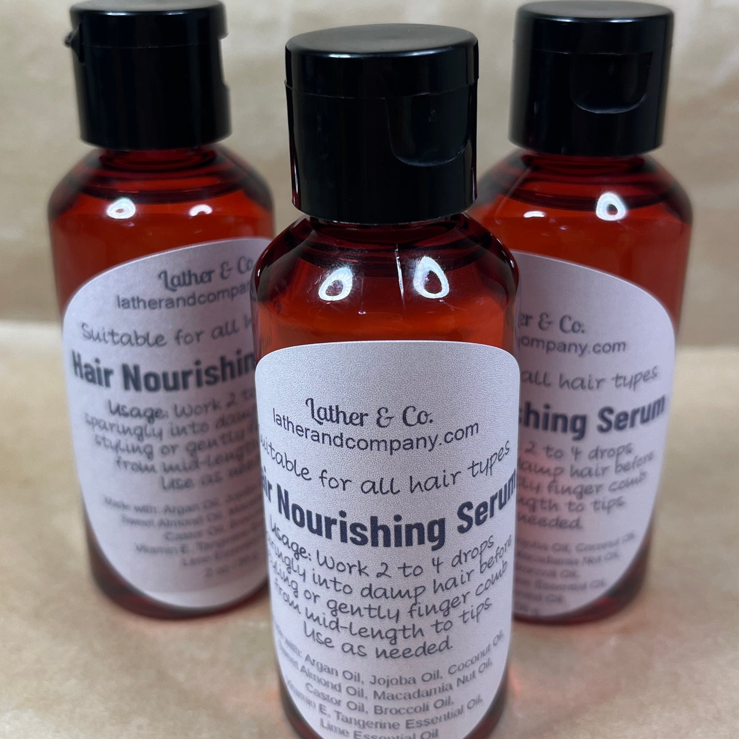 Hair Nourishing Serum by Lather & Co., each with a dropper cap.