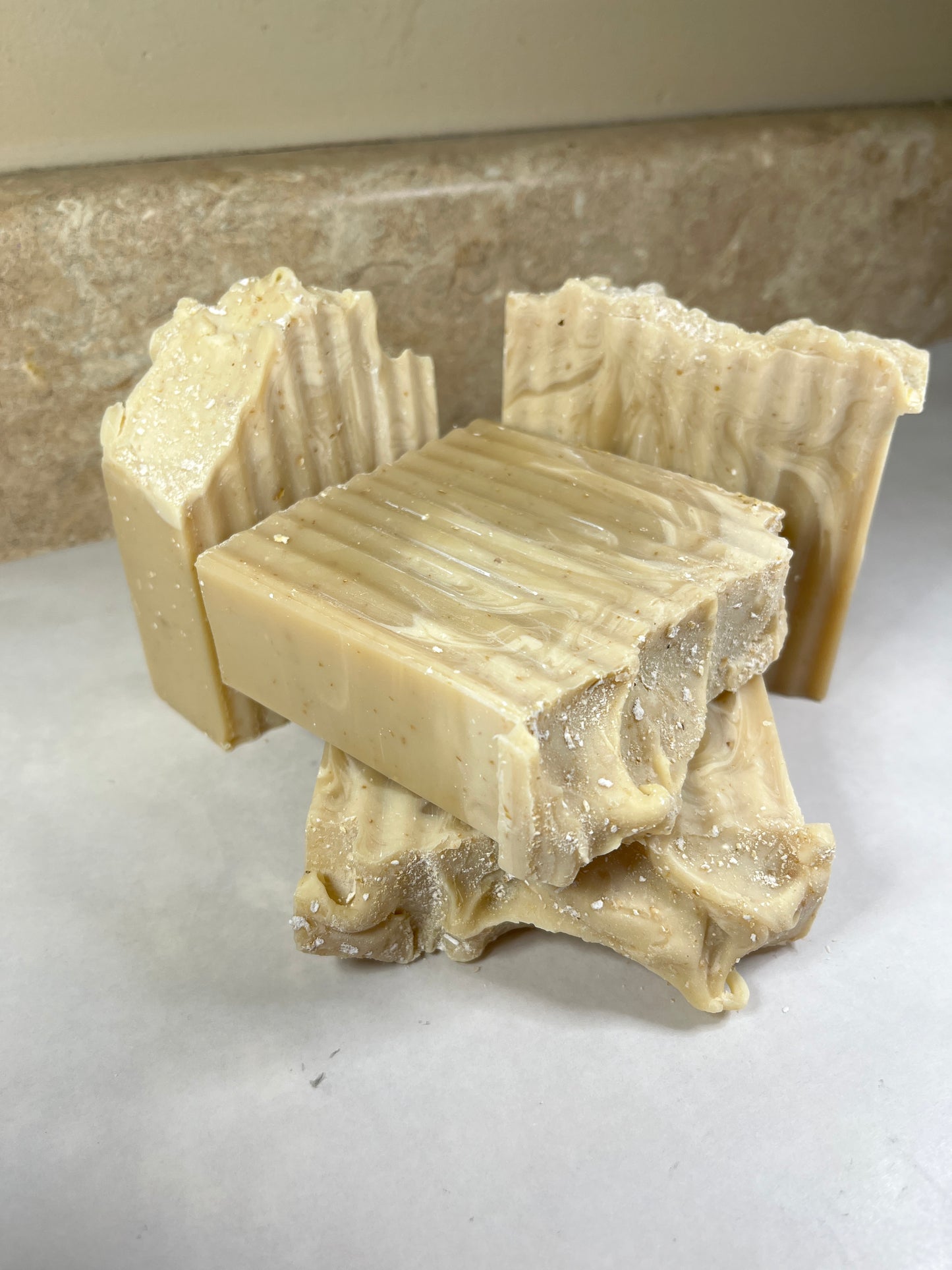 Close-up of a bar of soap with a textured surface on a white background