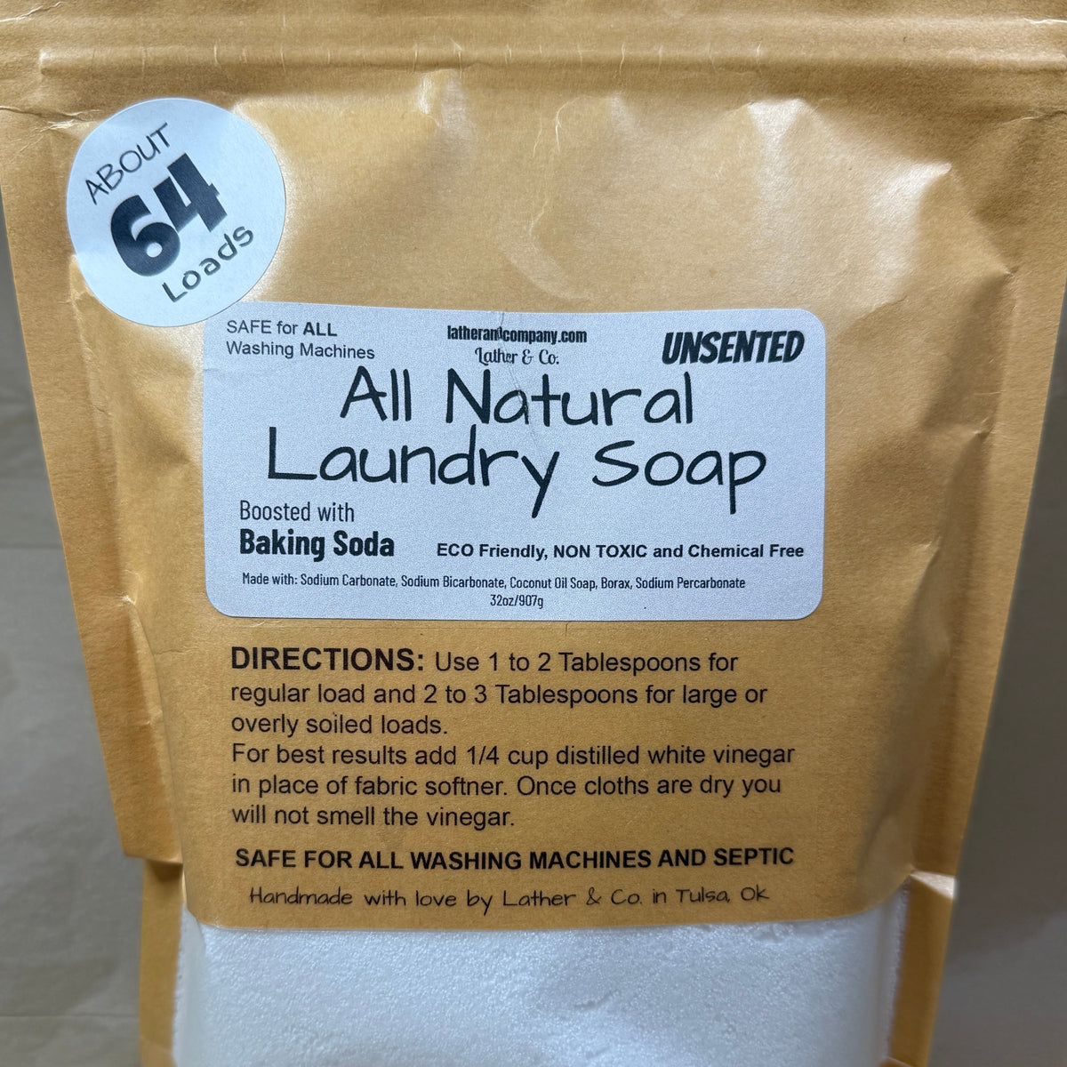 All natural laundry soap package with a label on a neutral background
