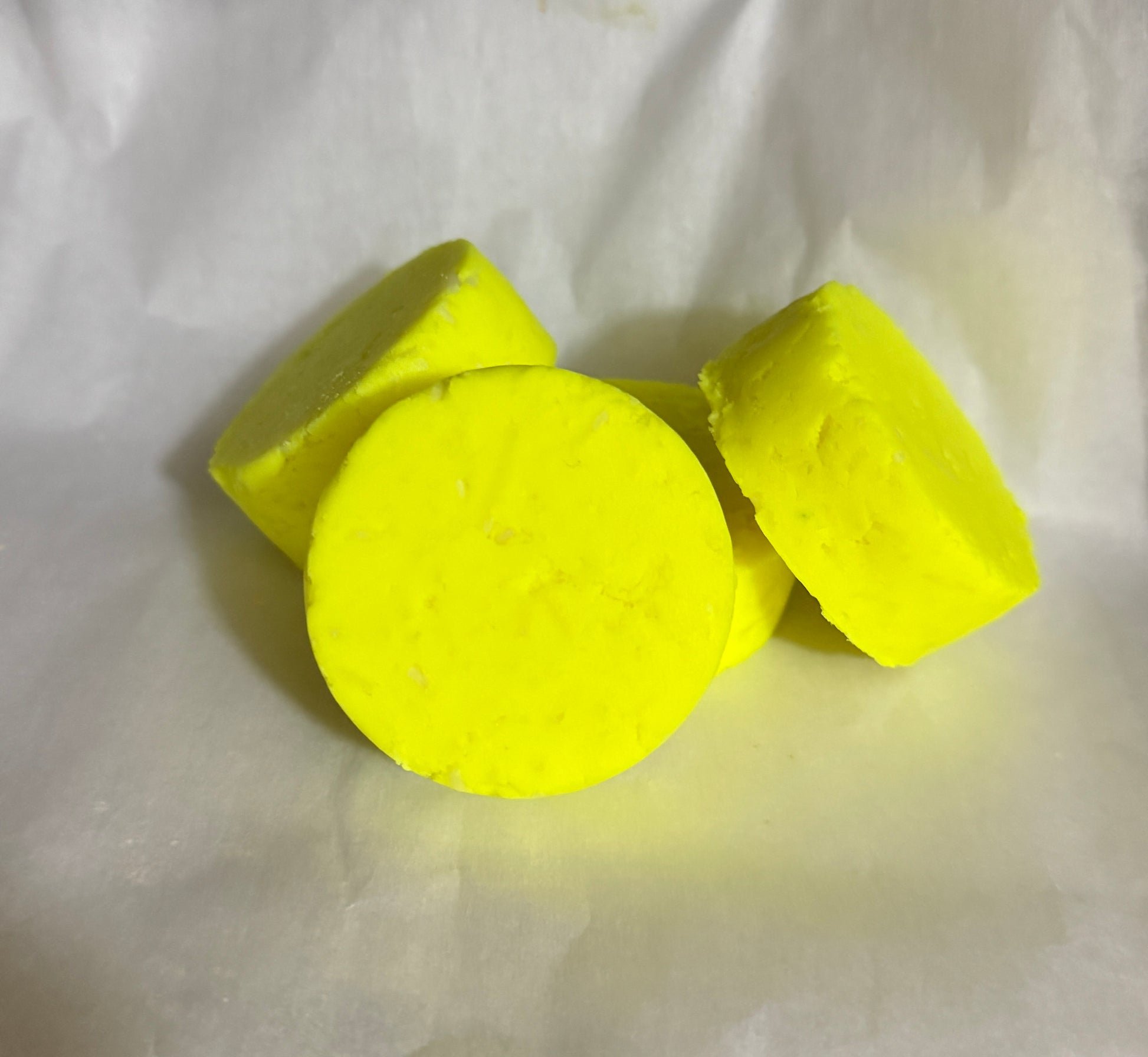 Two yellow dumbbells on a white background